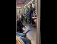 Collab WINY - Man rides subway in Christmas tree costume