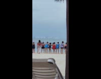 Old women bikini bend for beach photo