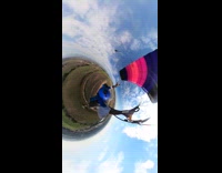 360 view of parachuting above field 