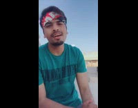 Guy blue shirt sings in foreign language