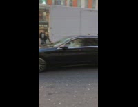 Girls stand in middle of road for photo 