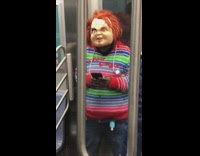 Man dressed as chucky doll on phone