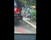 Man do inch push ups behind car