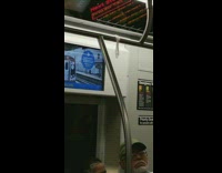 Used condom hangs from handrail on subway train
