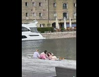 Four women poses with yarns by the canal