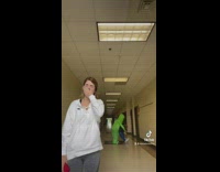 Girl wearing costume pretends to get pulled by alien