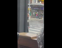 Bald guy balances bar on head 