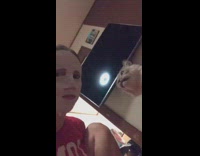 Cat looks at skincare face mask girl 