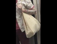 Small bug crawls up tote bag guy