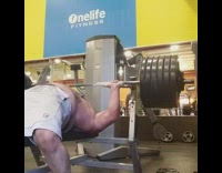 Michael Myers mask guy lifts weights gym