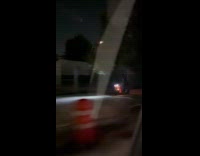 Man drive his motorcycle on sidewalk night