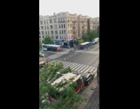 Car does donuts in intersection blocks bus