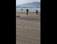 Man kneel down hands with sands photo shoot