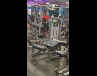 Guy wearing spiderman costume inside gym