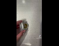 Woman dips pacifier in the Apple cider and kid rejects it