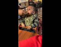 Little boy is not fond of lemon taste 