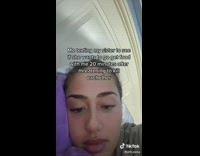 Girl purple pillow laying texting 