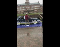Guy hits car sledgehammer slips on tarp