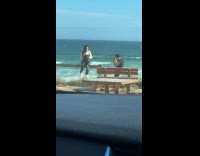 Collab IITW - Woman black leather corset poses at beach Part 1