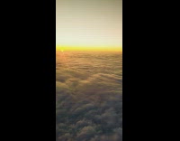Sunset view on the window of the airplane