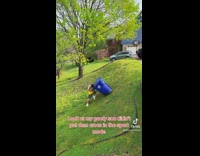 Son tries to push trash bin up 