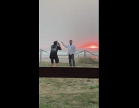 White shirt guy hand out holds sun 