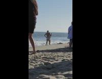 Man and Woman sexy dance together at the beach