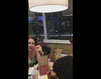 Guy smokes inside of a McDonalds restaurant, girl starts cussing 
and flips off camera