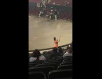 Collab IITW - Woman in orange dress poses near the concert stage