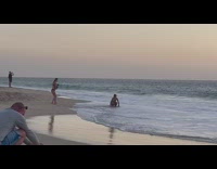 Woman arch backward crab pose beach sunset