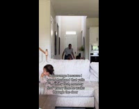 Man kisses wife before he lifts children