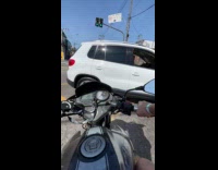Man POV rides motorcycle and hits car