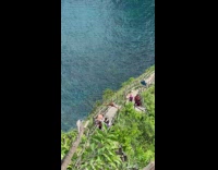 Tourist does splits on bridge 