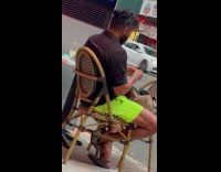 Collab WINY - Man sit on chair roll weed street