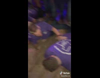 Bunch of guys get on the floor to wobble 