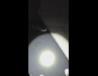 Guy climbs green toy tower at night 