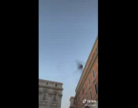 Starling birds flocking together to create a flowing shadow