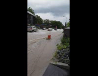 Biker Loses Bike in Flood and Yells for Help 