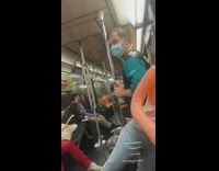 man dressed in jersey with a blow up doll