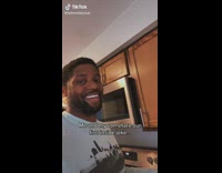 Dad and baby son laugh at inside joke