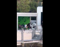 Rick Ross jams to his music seaside