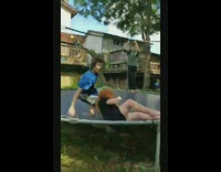 Guy backflip hits black shirt girl trampoline 