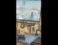 Two women tiktok dance outside tattoo shop