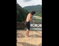 Three guys light pants on fire bridge water 