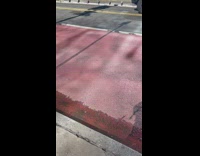 Wooden casket in back of red truck 