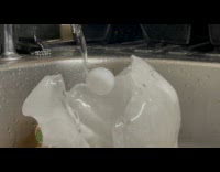 Ice block melted under faucet at sink