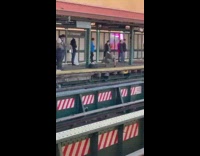 Grey shirt guy handstand by train platform