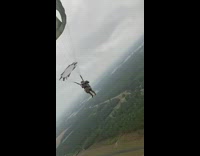 Army guy in parachute hanging with friends 