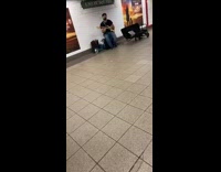 Guy with one hand plays electric guitar