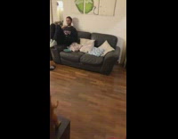 Guy throws red pokeball at friend couch